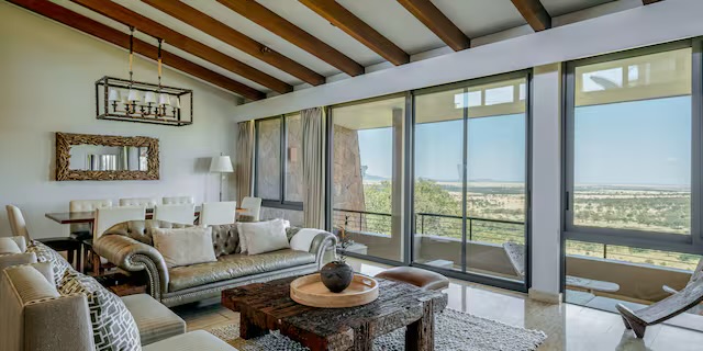Living lounge with floor-to-ceiling views at Meliá Serengeti Lodge
