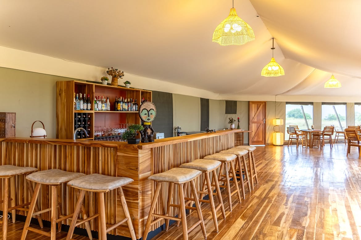 Timber bar with stools inside the Malaika main tent