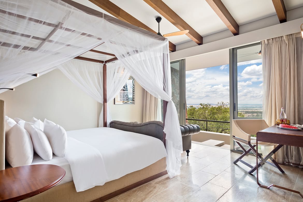 Canopy bed suite with panoramic Serengeti view at Meliá