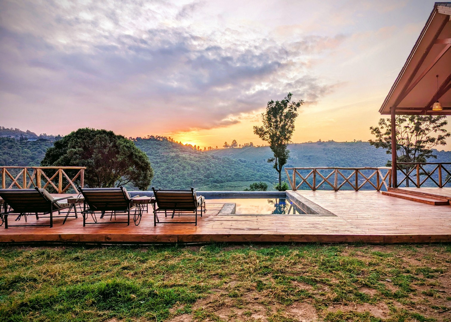 Infinity pool deck at Mvuli Lodge overlooking Arusha hills at sunset