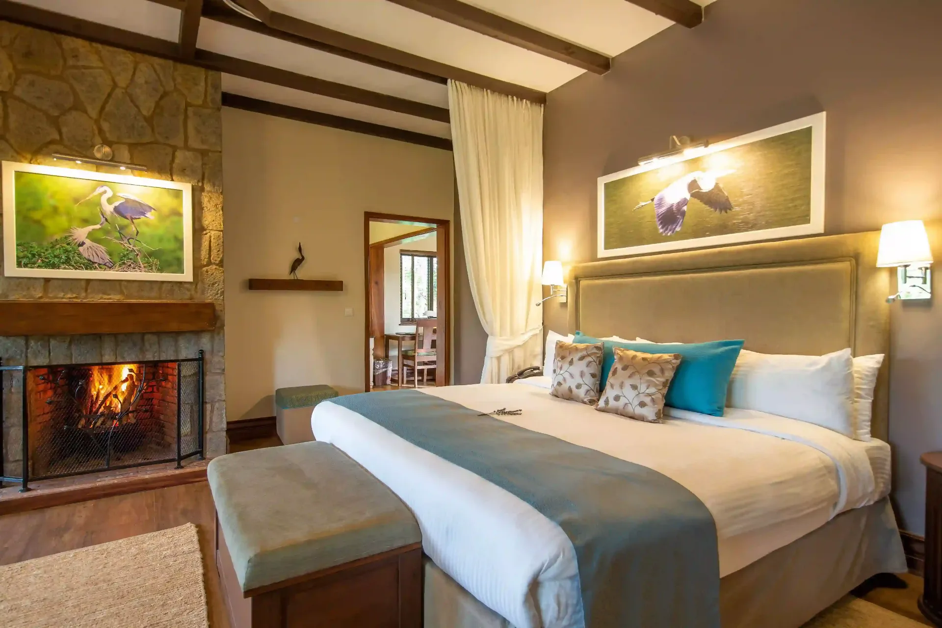King bedroom suite with fireplace at The Retreat at Ngorongoro