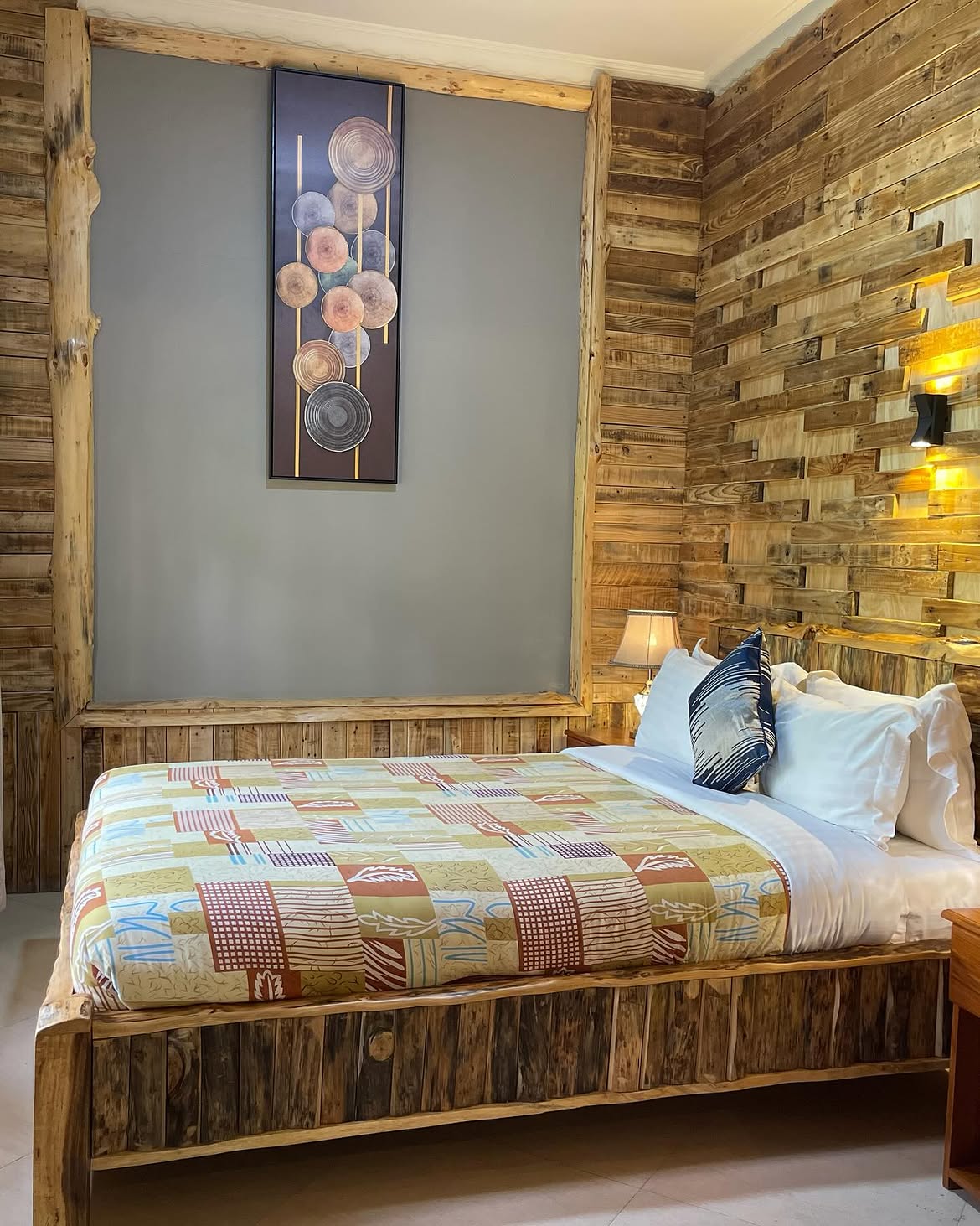 King bedroom with rustic wood interior at Under The Shade