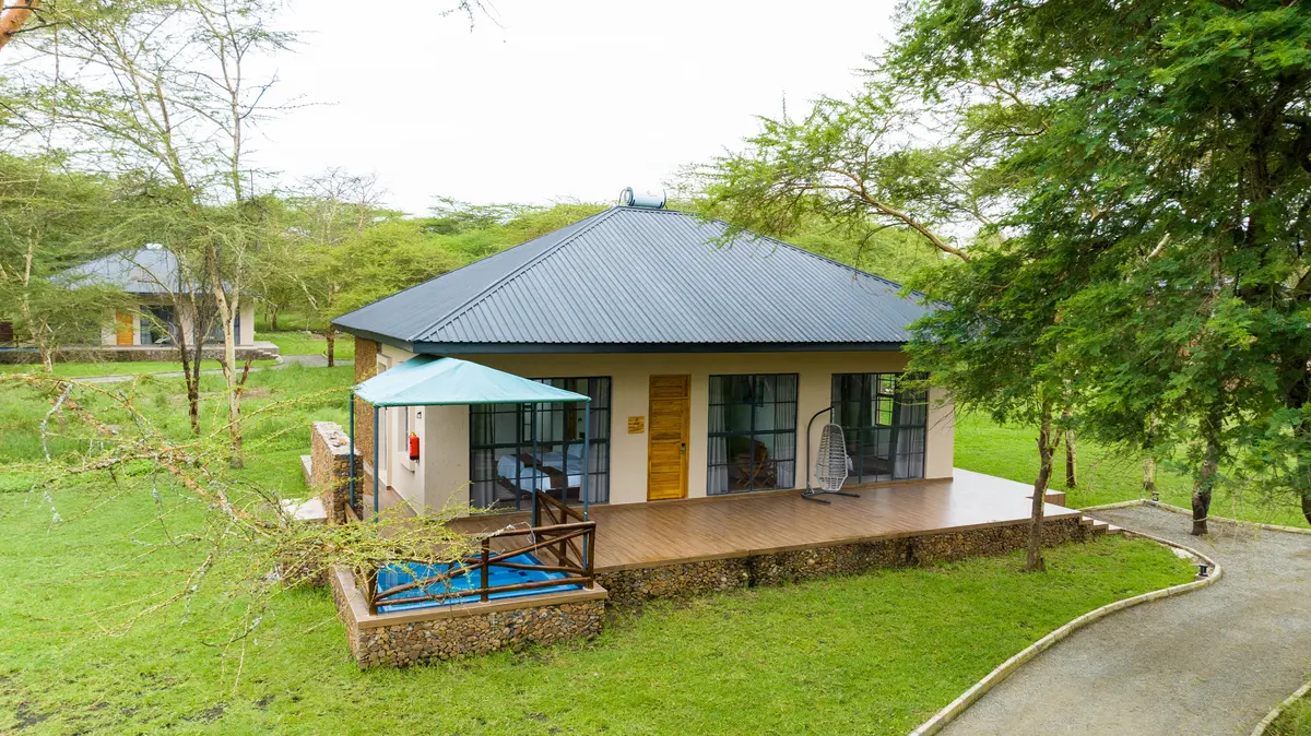 Aya Sophia Wildlife Villa exterior with private deck and acacia trees
