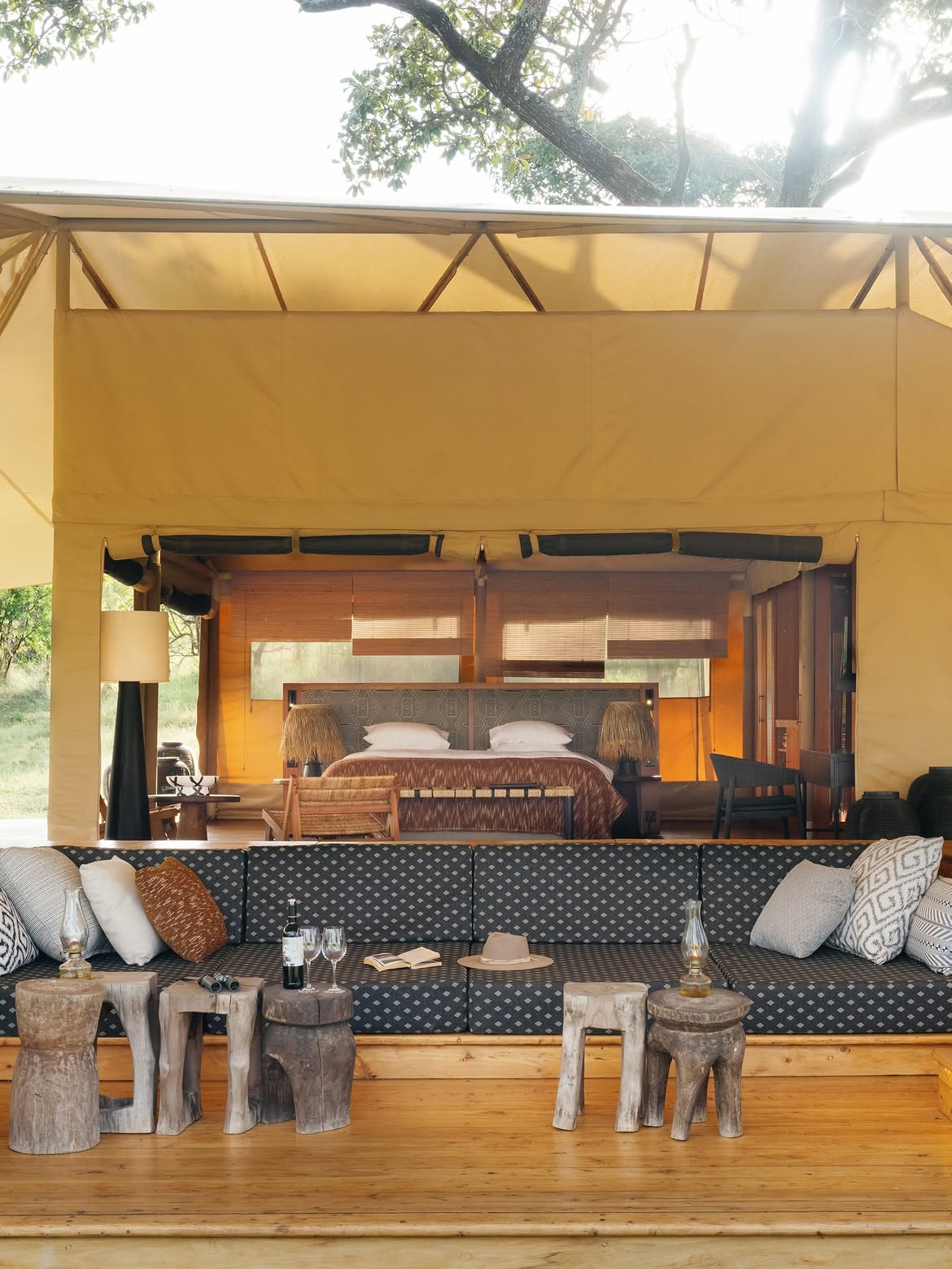 Open-front tent lounge and bedroom at Bushtop Serengeti