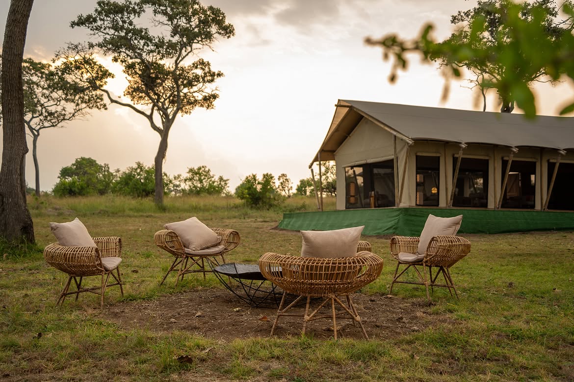 Malaika tented camp with fire pit and sunset acacia views