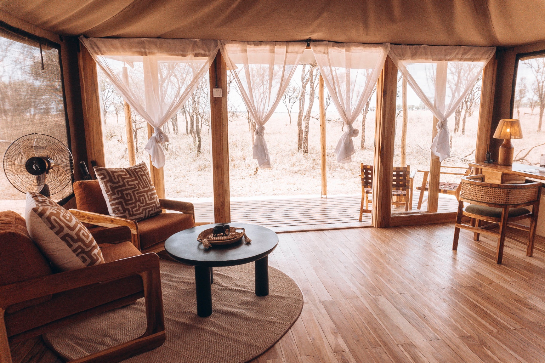 Interior lounge of a Conserve Safari luxury tent with bush views