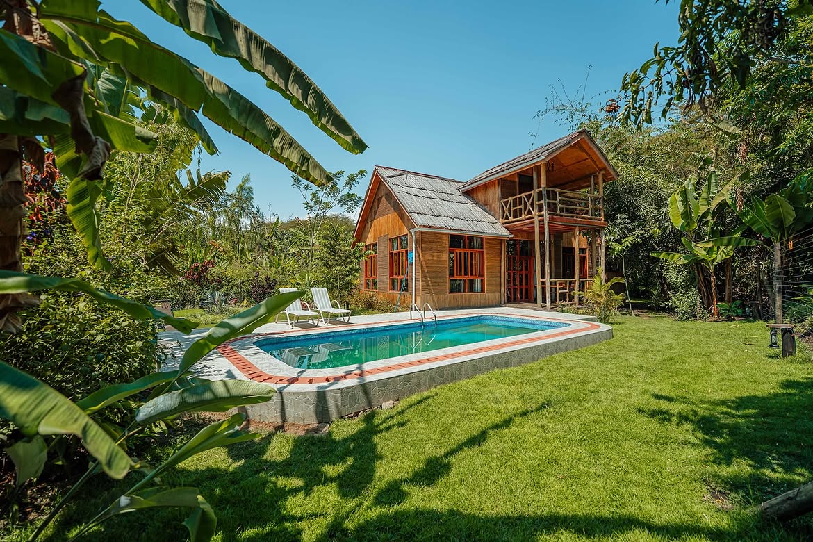 Cottage with private pool surrounded by banana trees at Under The Shade