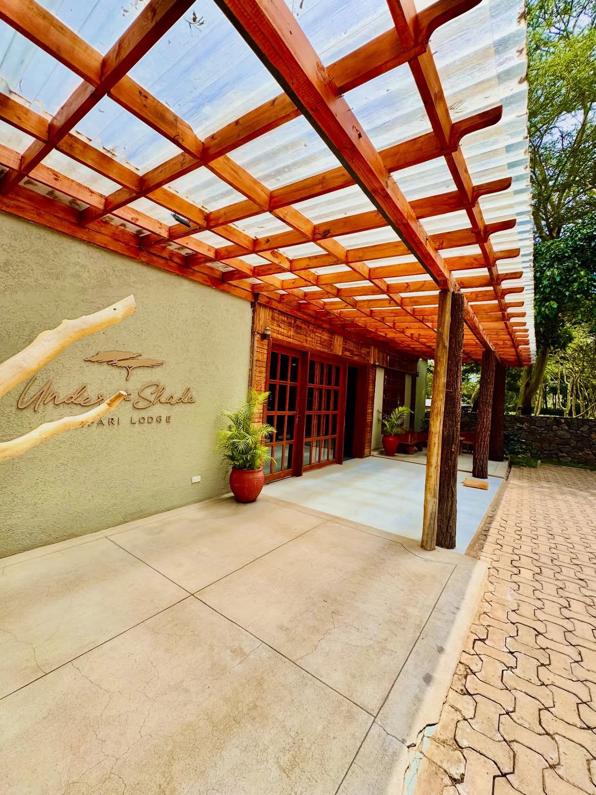 Under The Shade Safari Lodge reception entrance with pergola