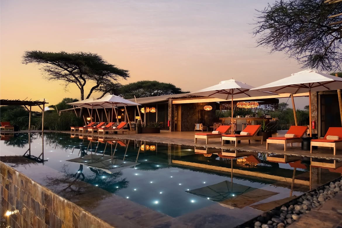 Infinity pool and bar deck at Mapito Safari Camp at sunset