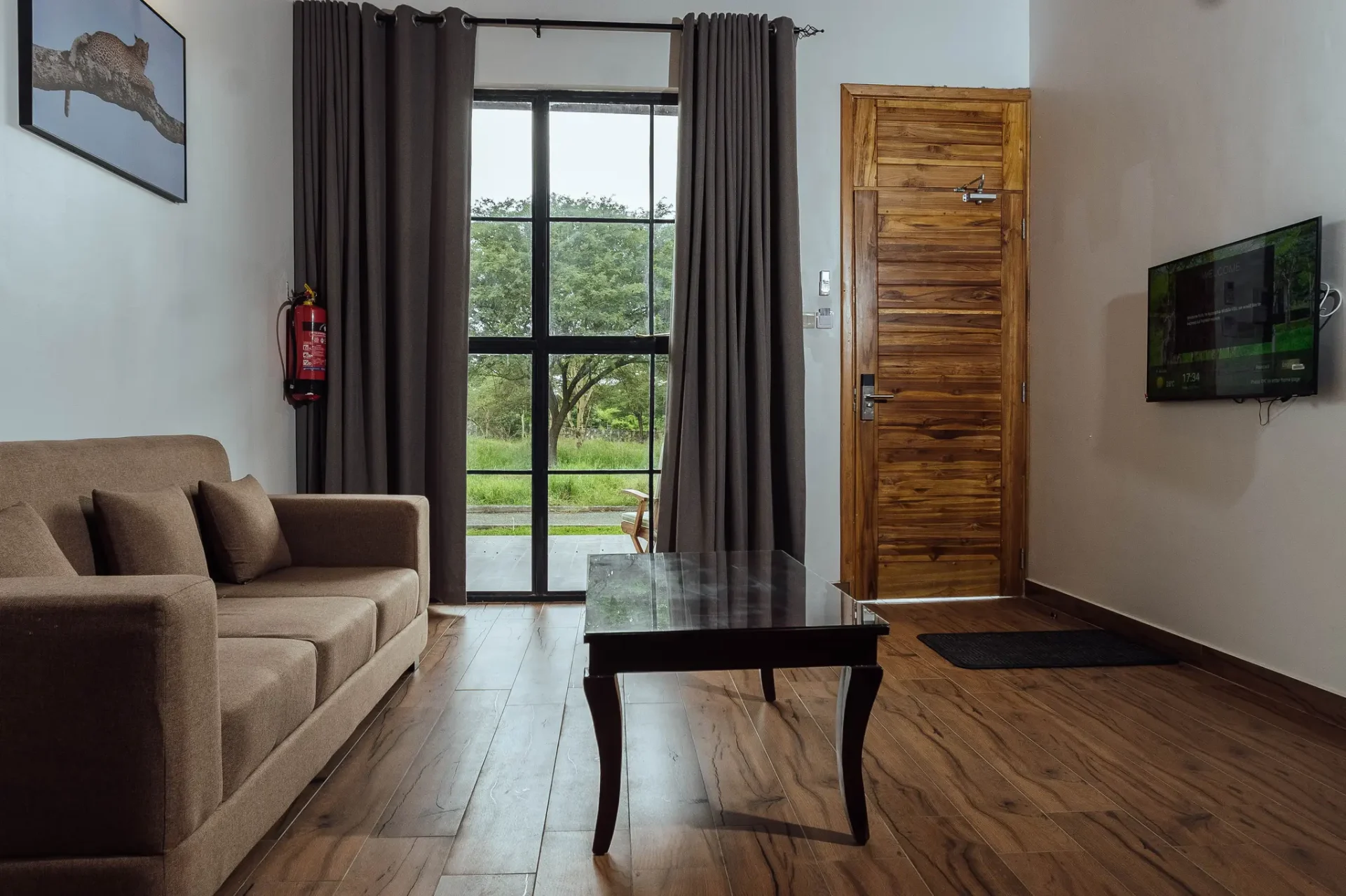 Aya Sophia villa lounge with wooden floors and bush view